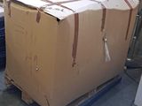 a large cardboard box sitting on a pallet in a warehouse
