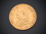 a close up of a gold coin on a black background