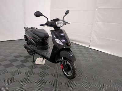 the motor scooter is parked on the floor in the room