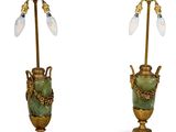 pair of green and gold urn lamps with glass shades