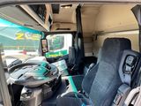 two seats in the back of a green van