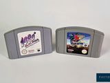 two nintendo games sitting next to each other on a table