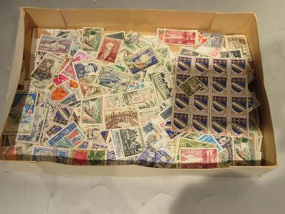 a box full of postage stamps sitting on a table