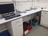 an image of a computer desk with a laptop on it