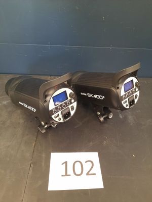 two walkie talkies sitting on the floor next to each other