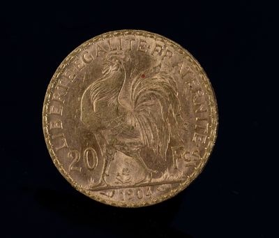 l'image d'une pièce d'or ornée d'un coq