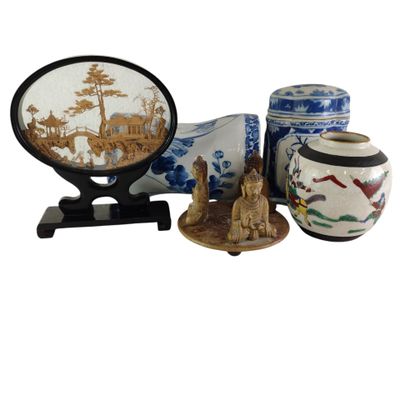 three vases and a mirror sitting on a table