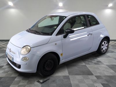 a picture of a small white car on a checkered floor