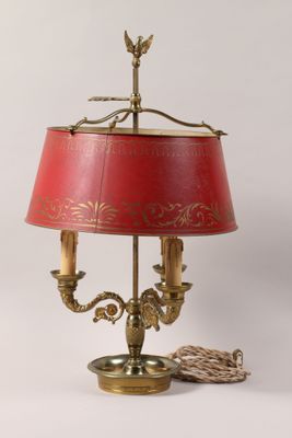 an image of a lamp with a red shade on a table