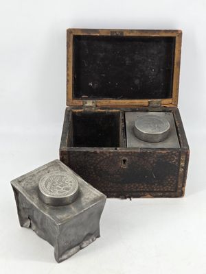 a small box that has a small metal object inside of it