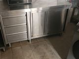 a kitchen with a microwave and a washer and dryer
