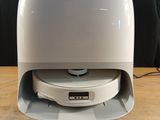 an image of a white and gray electronic device on a wooden table