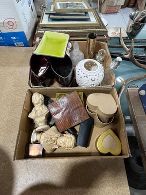 a box full of assorted items sitting on the floor