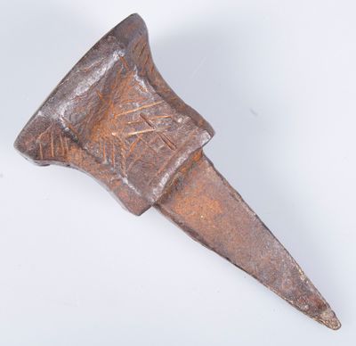 an old metal object on a white surface with a white background