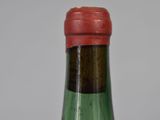 a close up of a bottle of wine on a table