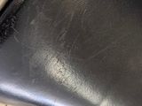 an image of a black leather chair in a public restroom