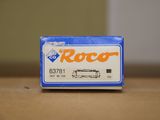 a blue box with a white and orange logo sitting on a table