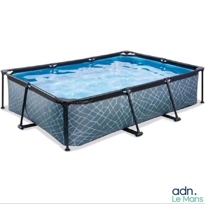 a large rectangular swimming pool with a metal frame and blue water