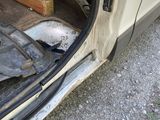 a car with the door open and the back door open