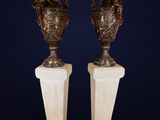 pair of antique bronze vases on marble bases