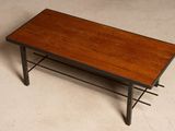 a coffee table with a wooden top and metal legs