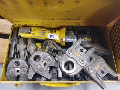 a box full of tools that are sitting on the floor