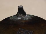 a close up of a metal object with a tag on it