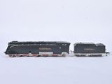 a toy train that is sitting on a white surface