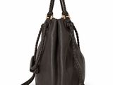 a black leather bag with braid handles and a handle