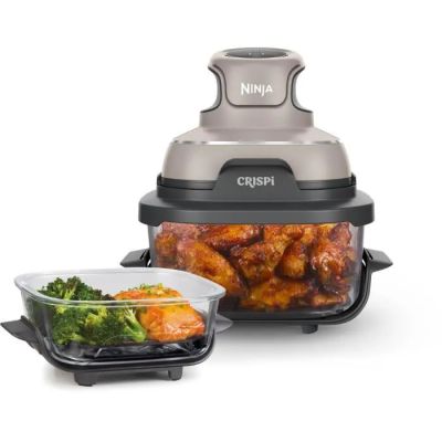 an image of a air fryer with chicken and broccoli in it