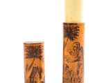 candle holder made of wood with a picture of a man and a woman on a beach