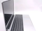 a close up of a laptop computer on a white surface
