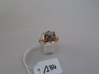 a gold ring with a diamond on it and a price tag attached to it