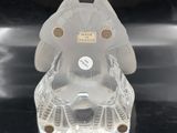 a clear elephant figurine sitting on a black surface