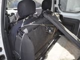 a seat in the back of a van with a bag in it