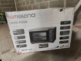 packaging for a toaster oven sitting on top of a cardboard box