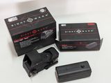 a black box with a red dot on it and a black box with a red dot on it