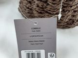 two baskets that are on a table with a price tag