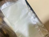 a person holding a piece of paper in a box