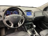 the interior of a car with a steering wheel and dashboard controls
