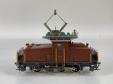 a toy train that is sitting on a white surface