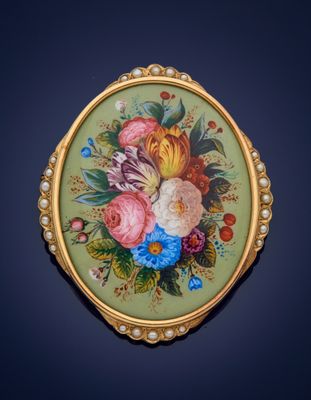 a picture of a picture of a broochle with flowers on it