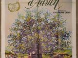 an old movie poster of a family gathering under a tree