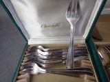 a box with a set of forks and spoons in it