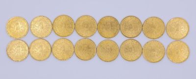 a close up of a row of gold coins on a white surface