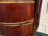 a large wooden bucket sitting on top of a green tray
