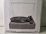 an image of a record player in a box on a table
