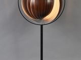 an image of a wooden lamp with a black metal base
