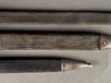four different types of knives are lined up on a table