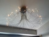 a large chandelier hanging from the ceiling in a room